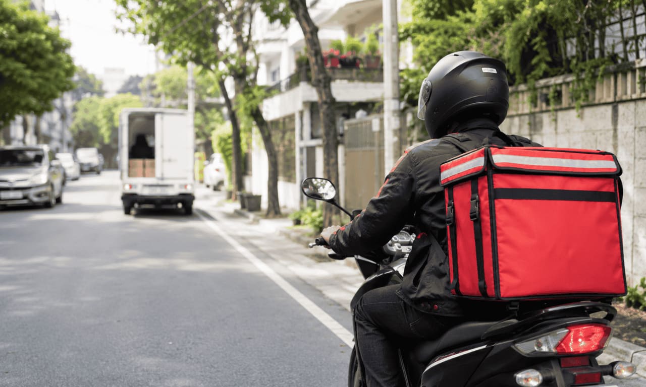 Same-day delivery fulfillment warehouse with conveyor and dispatch riders